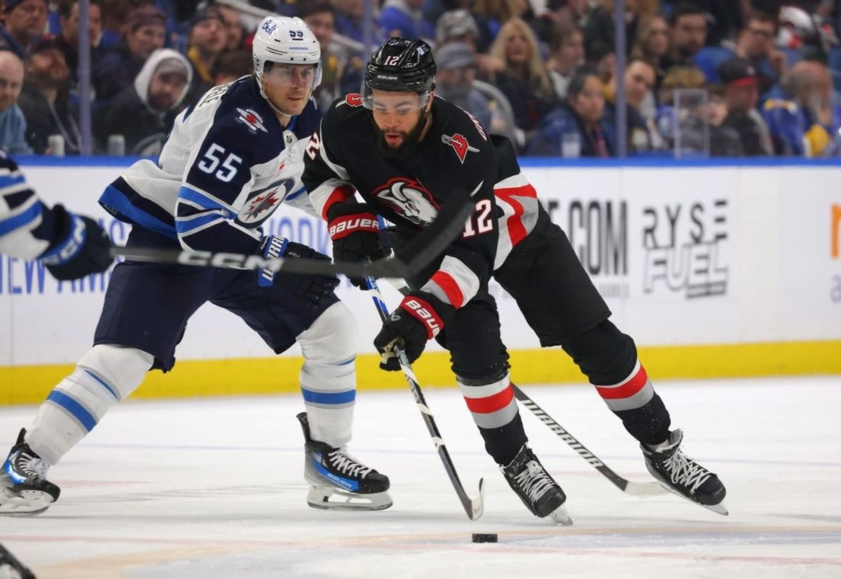 Mar 3, 2024; Buffalo, New York, USA;  Buffalo Sabres left wing Jordan Greenway (12) skates up ice with the puck during the second period against the Winnipeg Jets at KeyBank Center.
