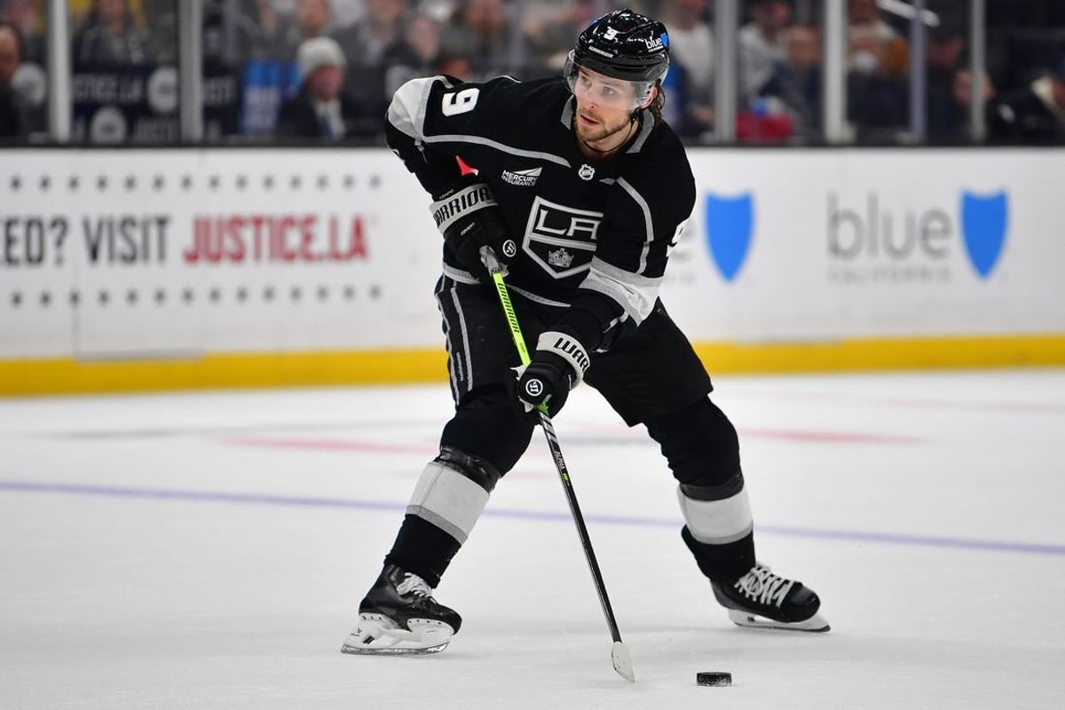Dec 30, 2023; Los Angeles, California, USA; Los Angeles Kings right wing Adrian Kempe (9) controls the puck against the Edmonton Oilers during the overtime period at Crypto.com Arena.