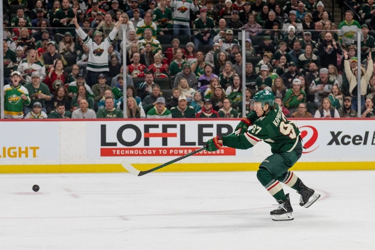 Mar 3, 2024; Saint Paul, Minnesota, USA; Minnesota Wild left wing Kirill Kaprizov (97) shoots and scores against the San Jose Sharks in the second period at Xcel Energy Center.