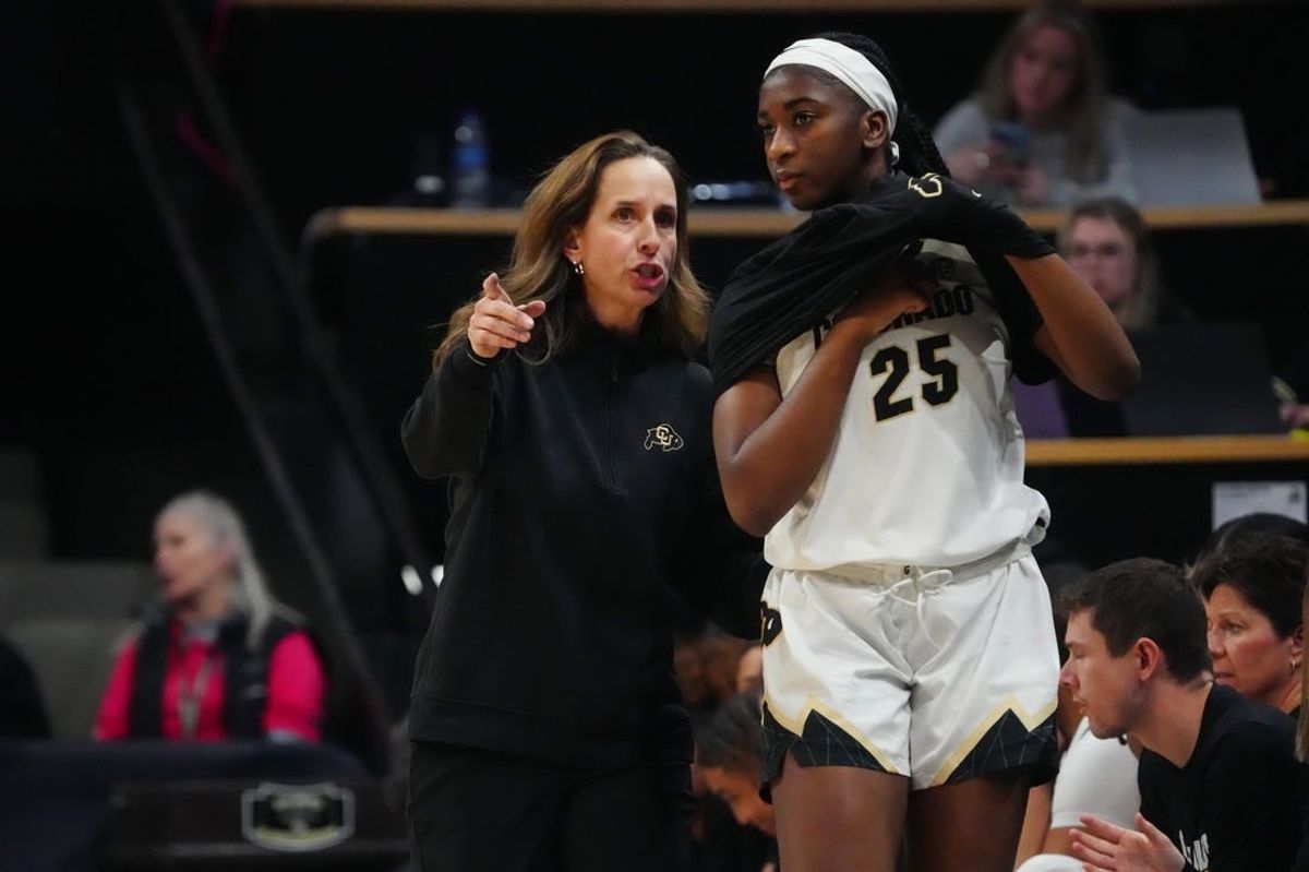 Feb 9, 2024; Boulder, Colorado, USA; Colorado Buffaloes head coach JR Payne talks to forward Brianna McLeod (25) in the second half against the Oregon Ducks at CU Events Center.