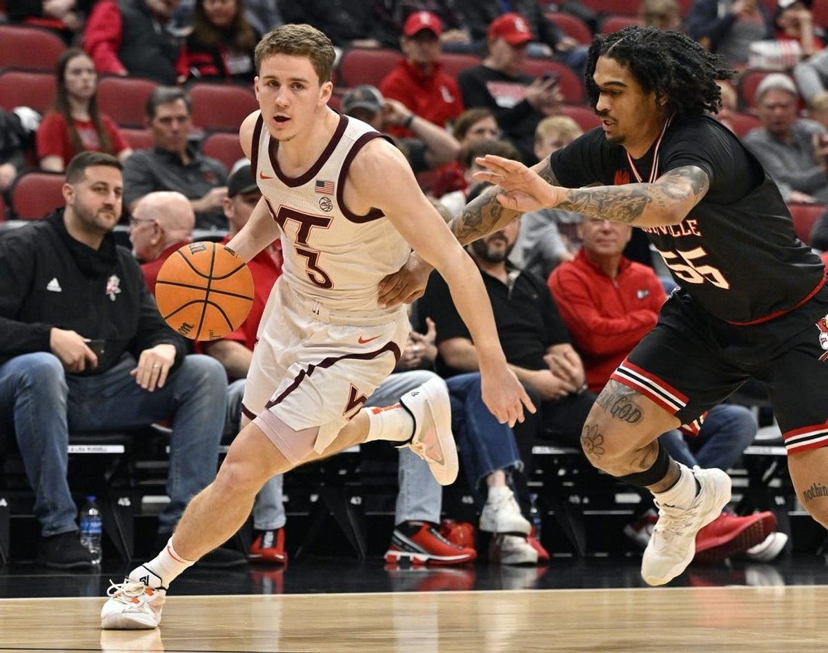 Mar 5, 2024; Louisville, Kentucky, USA; Virginia Tech Hokies guard Sean Pedulla (3) dribbles against Louisville Cardinals guard Skyy Clark (55) during the first half at KFC Yum! Center. Virginia Tech defeated Louisville 80-64.