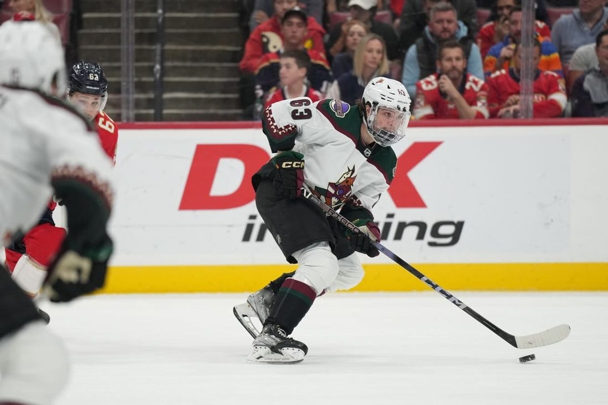Jan 24, 2024; Sunrise, Florida, USA; Arizona Coyotes left wing Matias Maccelli (63) brings the puck up the ice during the first against the Florida Panthers at Amerant Bank Arena.