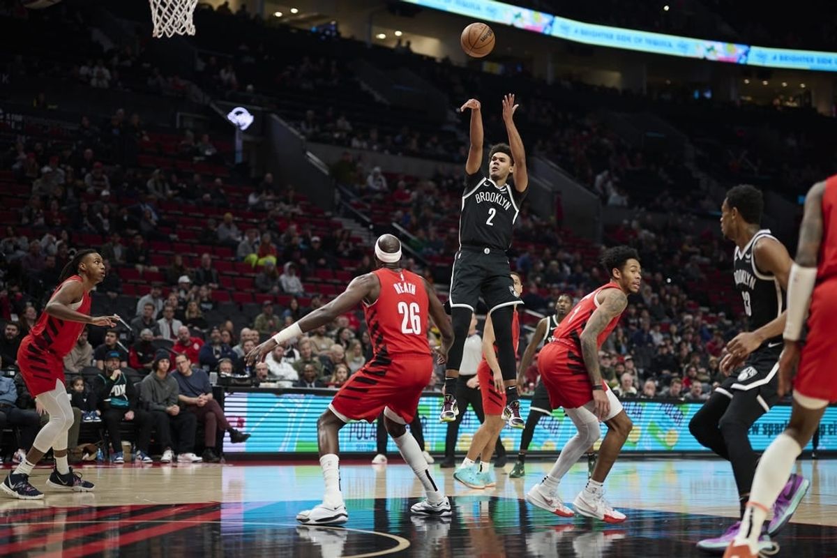 Jan 17, 2024; Portland, Oregon, USA; Brooklyn Nets forward Cameron Johnson (2) shoots a basket during the first half against Portland Trail Blazers center Duop Reath (26) at Moda Center.