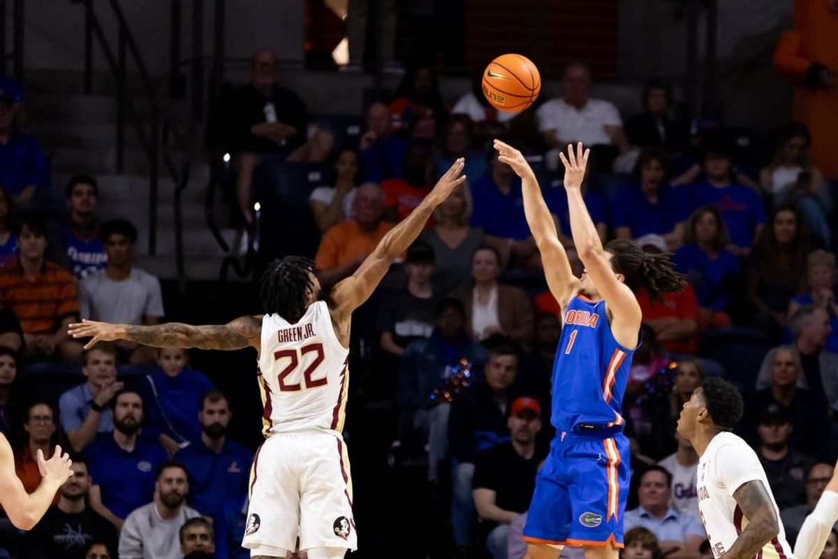 Nov 17, 2023; Gainesville, Florida, USA; Florida Gators guard Walter Clayton Jr. (1) shoots over Florida State Seminoles guard Darin Green Jr. (22) during the first half at Exactech Arena at the Stephen C. O'Connell Center.