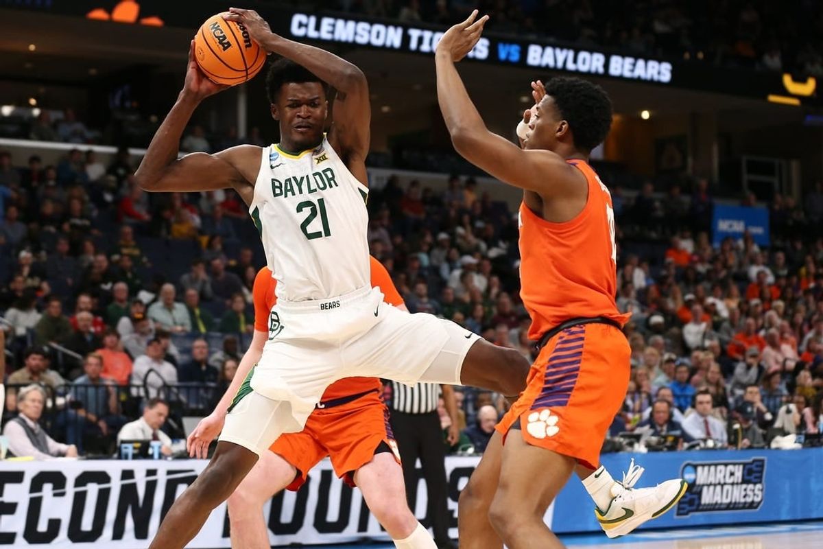 Mar 24, 2024; Memphis, TN, USA; Baylor Bears center Yves Missi (21) controls the ball against Clemson Tigers forward RJ Godfrey (10) in the second half in the second round of the 2024 NCAA Tournament at FedExForum.