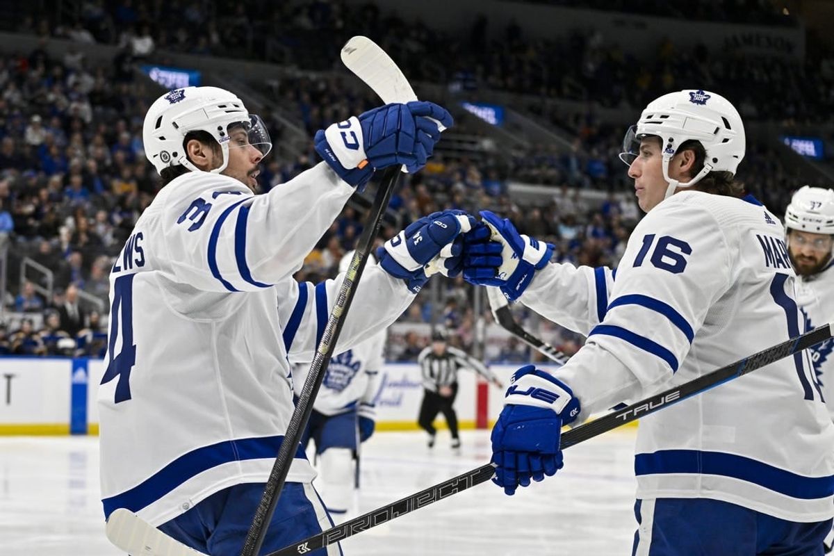 Feb 19, 2024; St. Louis, Missouri, USA;  Toronto Maple Leafs center Auston Matthews (34) celebrates with right wing Mitchell Marner (16) after scoring against the St. Louis Blues during the third period at Enterprise Center.