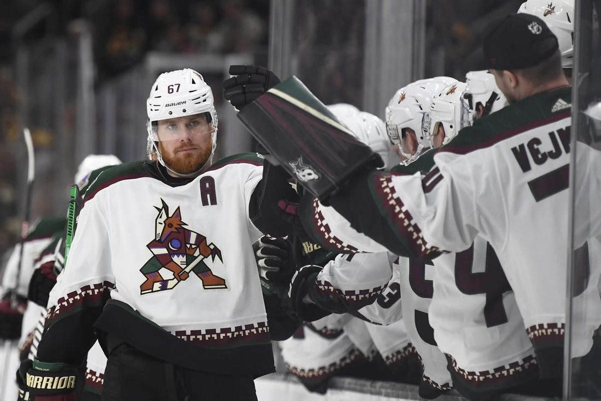 Dec 9, 2023; Boston, Massachusetts, USA;  Arizona Coyotes left wing Lawson Crouse (67) celebrates with teammates after scoring a goal against the Boston Bruins during the third period at TD Garden.