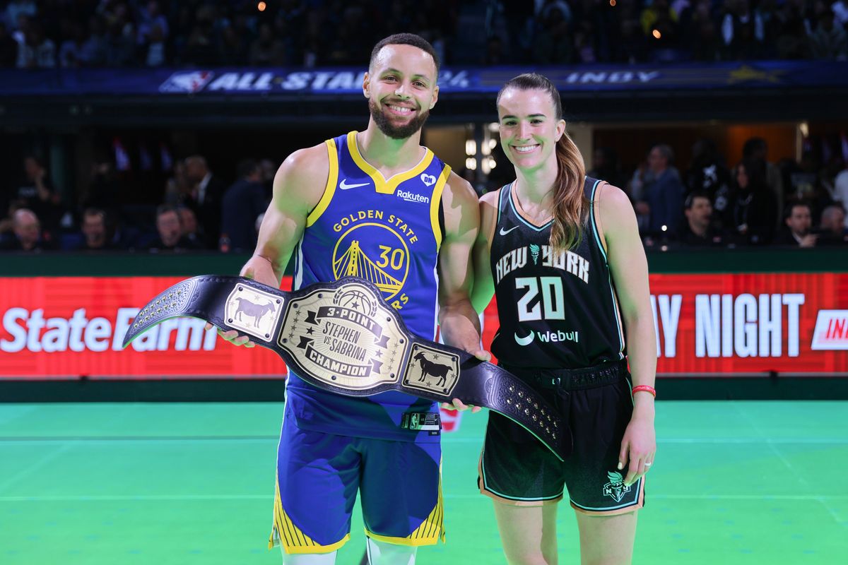 Stephen Curry of the Golden State Warriors and Sabrina Ionescu of the New York Liberty pose for a photo after their 3-point challenge during the State Farm All-Star Saturday Night at Lucas Oil Stadium.