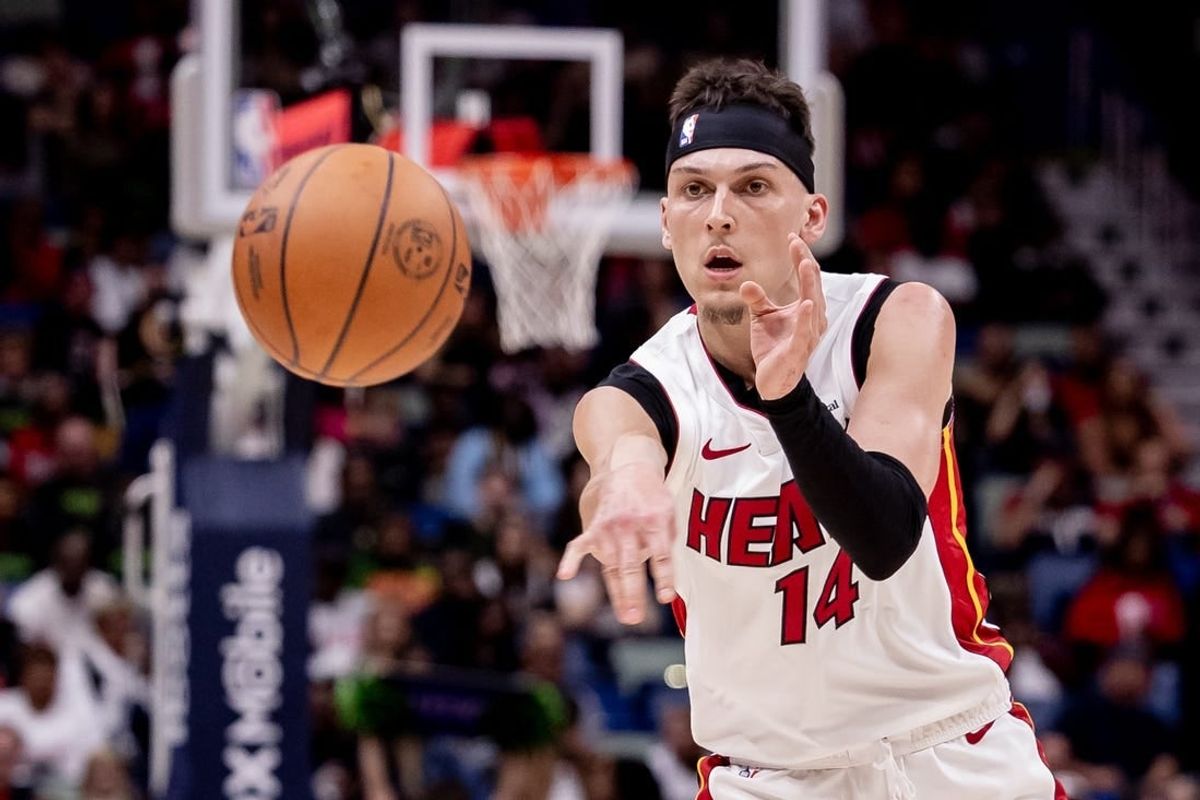 Feb 23, 2024; New Orleans, Louisiana, USA;  Miami Heat guard Tyler Herro (14) passes the ball against the New Orleans Pelicans during the first half at Smoothie King Center.