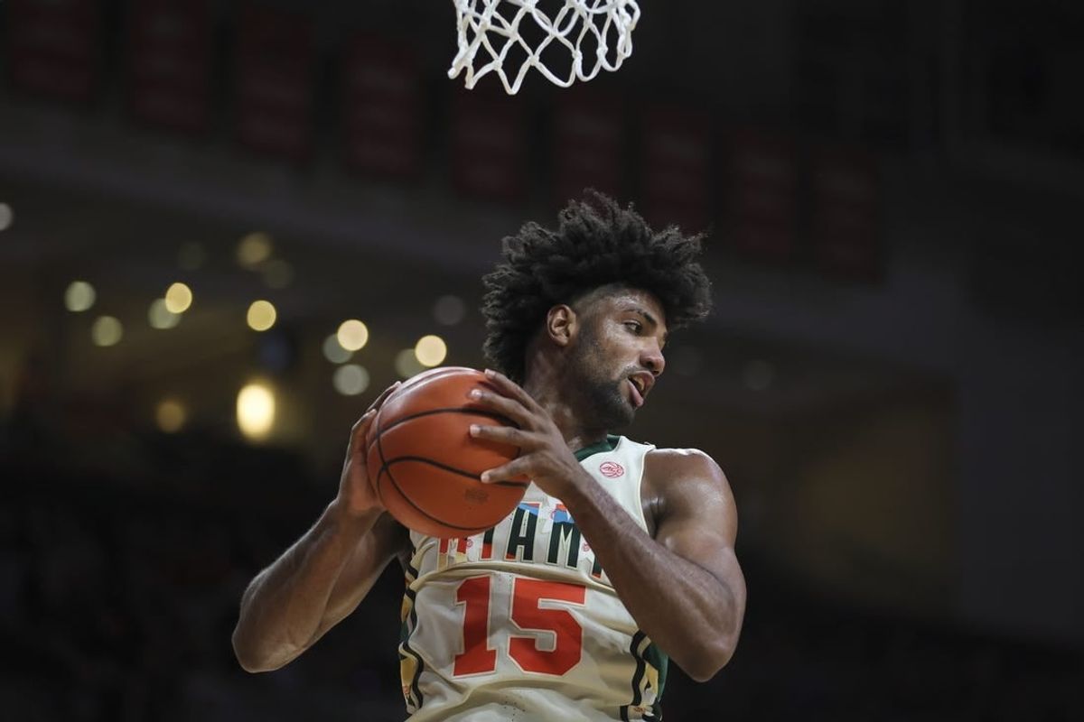 Feb 10, 2024; Coral Gables, Florida, USA; Miami Hurricanes forward Norchad Omier (15) grabs a rebound against the North Carolina Tar Heels during the first half at Watsco Center.