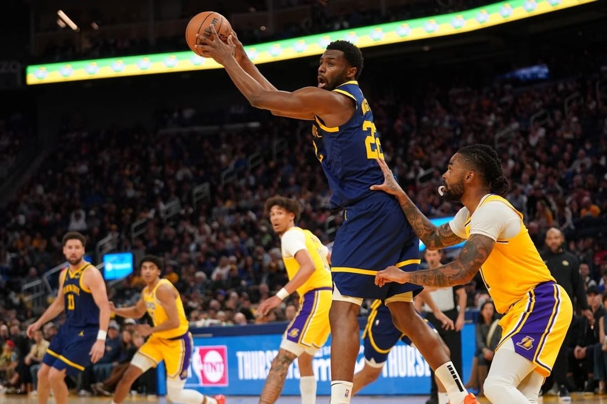 Feb 22, 2024; San Francisco, California, USA; Golden State Warriors forward Andrew Wiggins (22) holds onto a pass against the Los Angeles Lakers in the fourth quarter at the Chase Center.