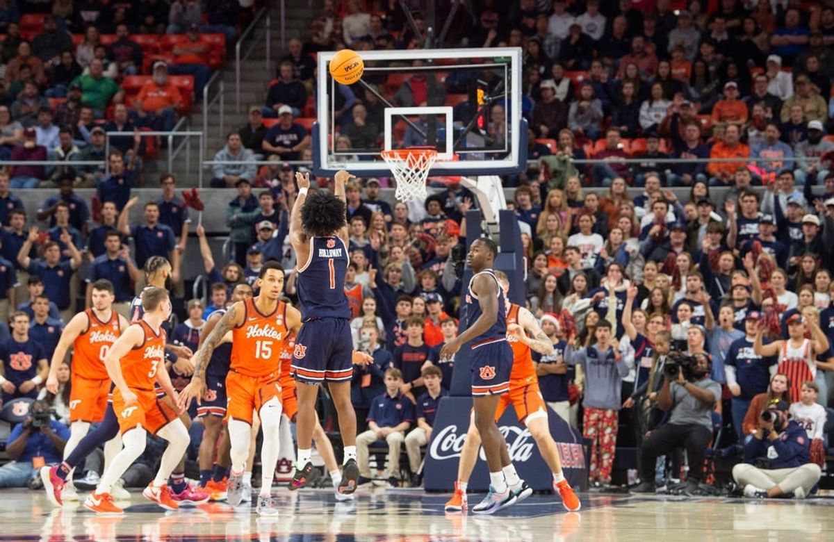 Auburn Tigers guard Aden Holloway (1) takes a jump shot as Auburn Tigers take on Virginia Tech Hokies at Neville Arena in Auburn, Ala., on Wednesday, Nov. 29, 2023.
