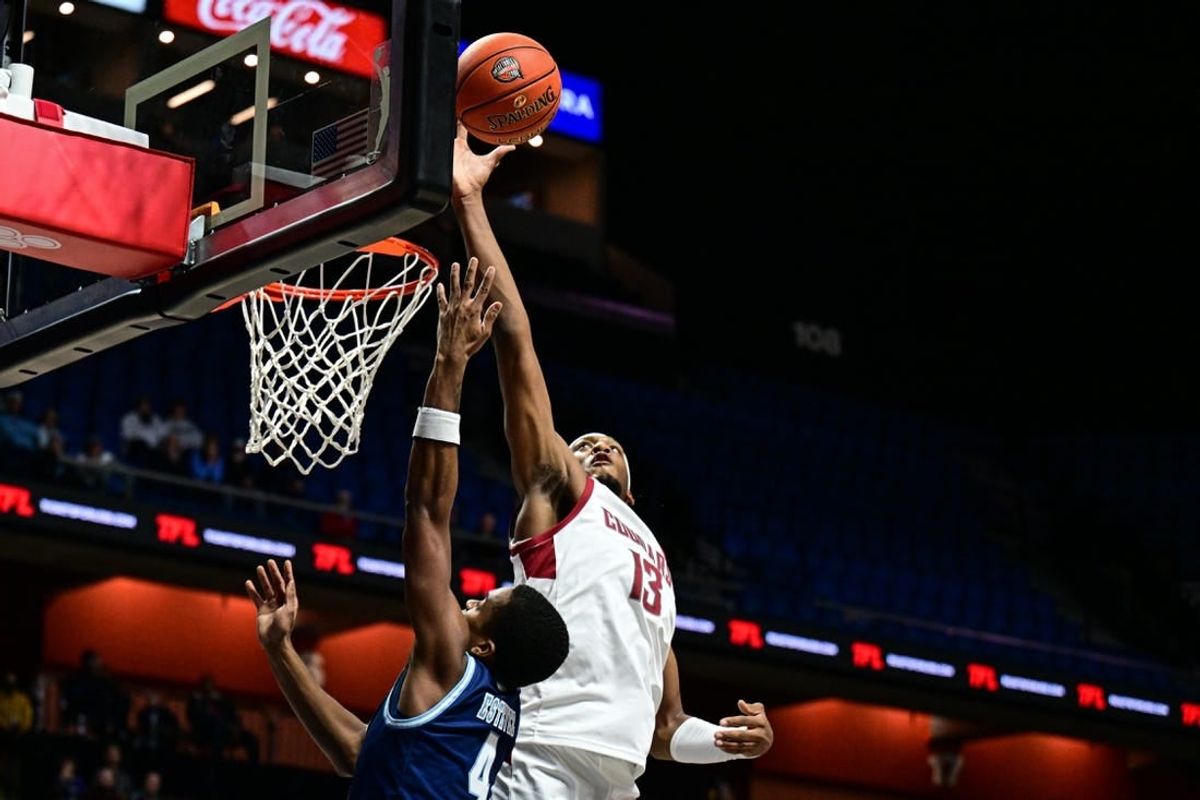 Nov 19, 2023; Uncasville, CT, USA; Washington State Cougars forward Isaac Jones (13) blocks a sot by Rhode Island Rams guard Cam Estevez (4) during the first half at Mohegan Sun Arena.