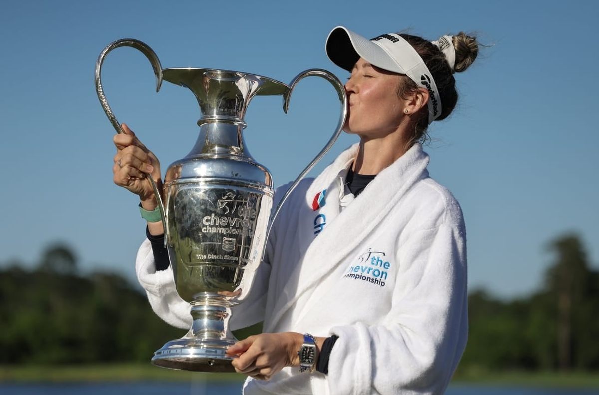 Apr 21, 2024; The Woodlands, Texas, USA; Nelly Korda (USA) kisses the trophy after winning The Chevron Championship golf tournament.