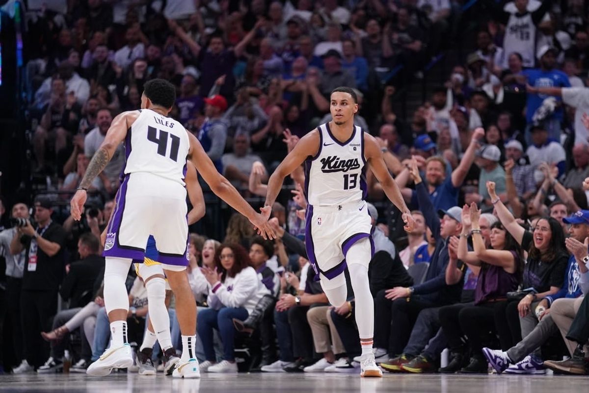Apr 16, 2024; Sacramento, California, USA; Sacramento Kings forward Keegan Murray (13) is congratulated by forward Trey Lyles (41) after making a three point basket against the Golden State Warriors in the fourth quarter during a play-in game of the 2024 NBA playoffs at the Golden 1 Center.