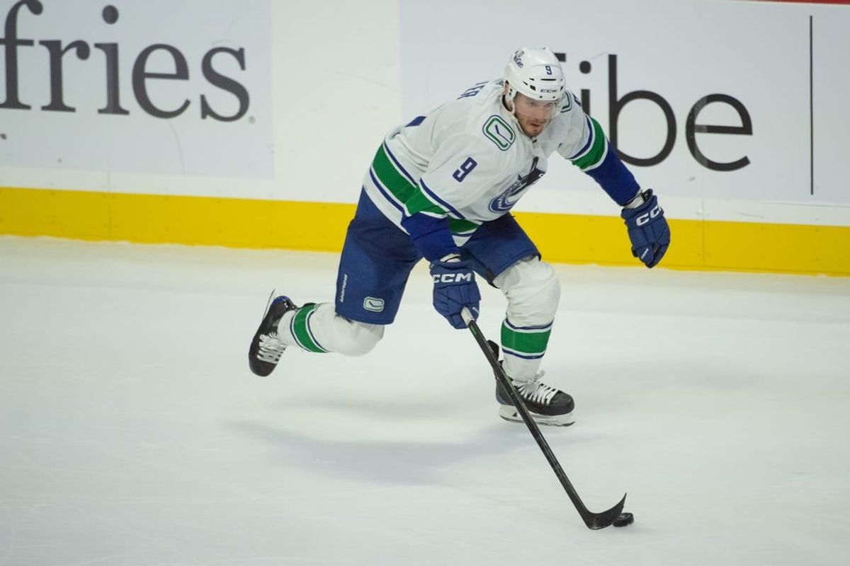 Nov 9, 2023; Ottawa, Ontario, CAN; Vancouver Canucks center J.T. Miller (9) skates with the puck in the third period against the Ottawa Senators at the Canadian Tire Centre.