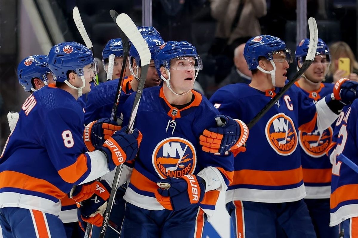 Jan 21, 2024; Elmont, New York, USA; New York Islanders center Bo Horvat (14) celebrates his game winning goal against the Dallas Stars with teammates during overtime at UBS Arena.