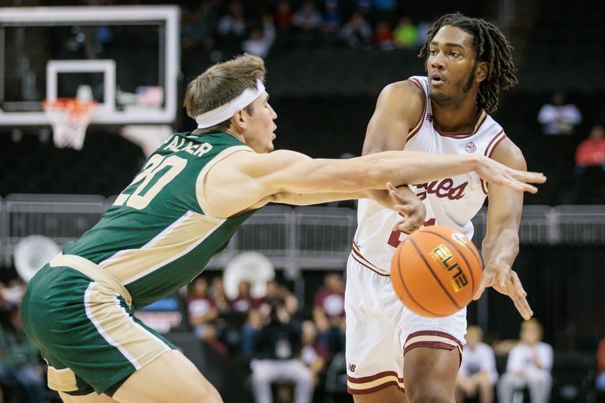 Nov 22, 2023; Kansas City, Missouri, USA; Boston College Eagles forward Devin McGlockton (21) passes the ball around Colorado State Rams guard Joe Palmer (20) during the first half at T-Mobile Center.