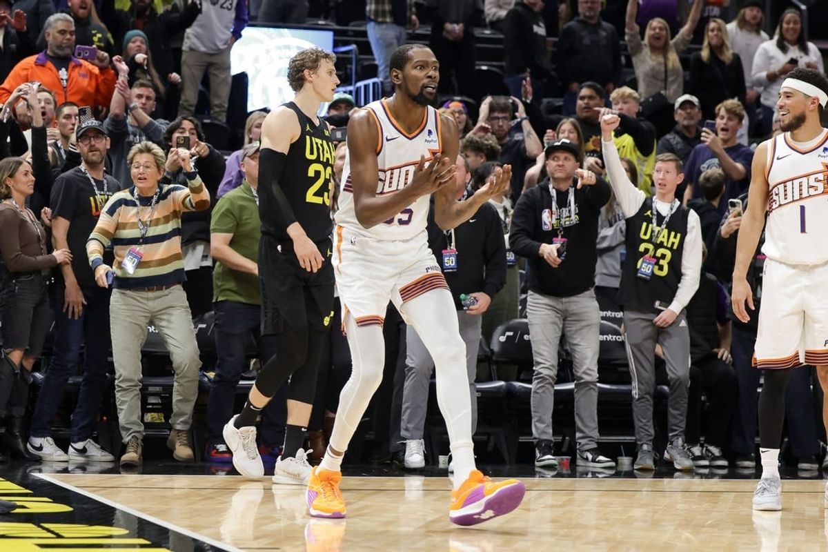 Nov 19, 2023; Salt Lake City, Utah, USA;  Phoenix Suns forward Kevin Durant (35) reacts after a foul is called on a shot by Utah Jazz forward Lauri Markkanen (23) during the second half at Delta Center.