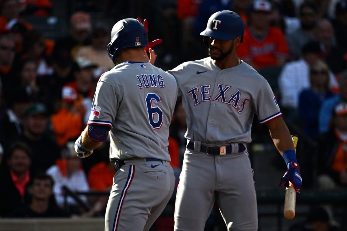 Oct 7, 2023; Baltimore, Maryland, USA; Texas Rangers third baseman Josh Jung (6) is congratulated by second baseman Marcus Semien (right) after hitting a home run against the Baltimore Orioles during the sixth inning in game one of the ALDS for the 2023 MLB playoffs at Oriole Park at Camden Yards.