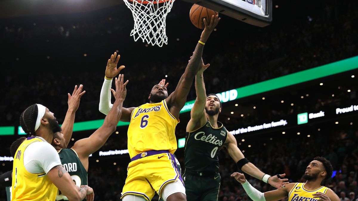 Jayson Tatum defends LeBron James in the final shot of regulation play during the fourth quarter at TD Garden on January 28, 2023 in Boston, Massachusetts.