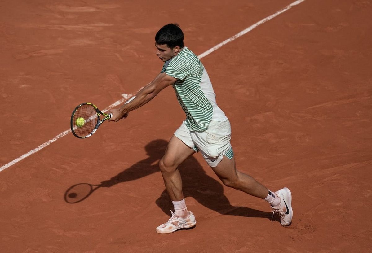 Jun 9 2023; Paris,France; Carlos Alcaraz (ESP) returns a shot during his semifinal match against Novak Djokovic (SRB) on day 13 at Stade Roland-Garros.
