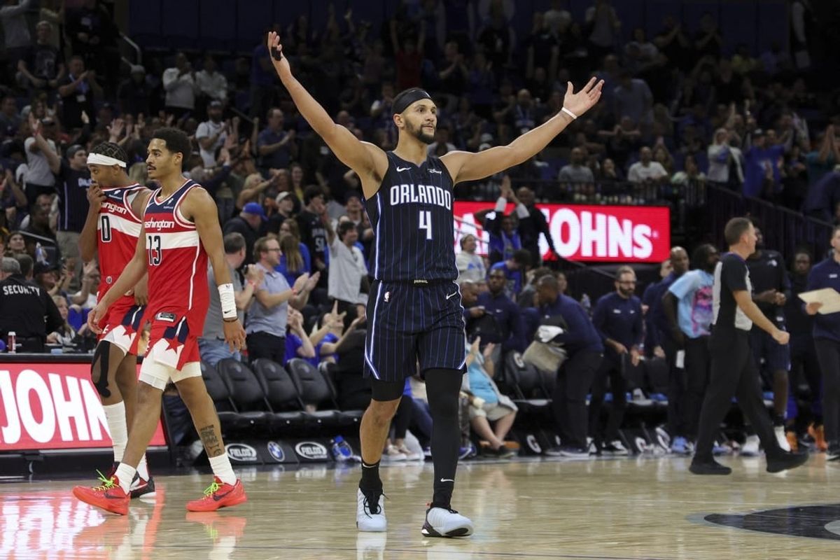 Dec 1, 2023; Orlando, Florida, USA;  Orlando Magic guard Jalen Suggs (4) reacts during a time out against the Washington Wizards in the fourth quarter at Amway Center.
