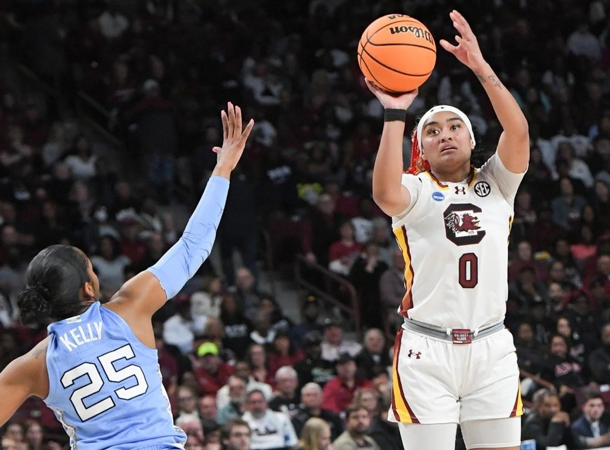 Mar 24, 2034; Columbia, So Carolina, USA;  South Carolina guard Te-Hina Paopao (0) makes a three-point shot near University of North Carolina guard Deja Kelly (25) during the second quarter of the second round NCAA Women's Basketball Tournament game at the Colonial Life Center.