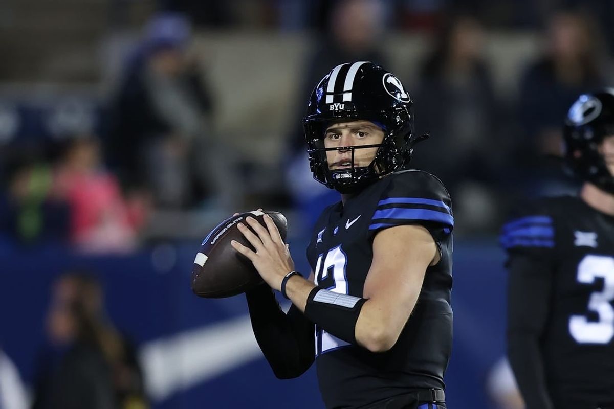 Nov 11, 2023; Provo, Utah, USA; Brigham Young Cougars quarterback Jake Retzlaff (12) warms up before the game against the Iowa State Cyclones at LaVell Edwards Stadium.