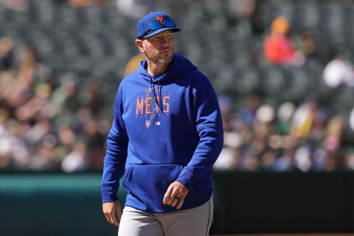 Apr 16, 2023; Oakland, California, USA; New York Mets pitching coach Jeremy Hefner walks to the dugout during the eighth inning against the Oakland Athletics at RingCentral Coliseum.