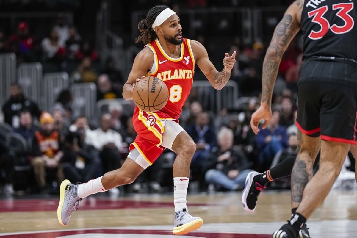 Jan 28, 2024; Atlanta, Georgia, USA; Atlanta Hawks guard Patty Mills (8) brings the ball up the court against the Toronto Raptors during the first half at State Farm Arena.