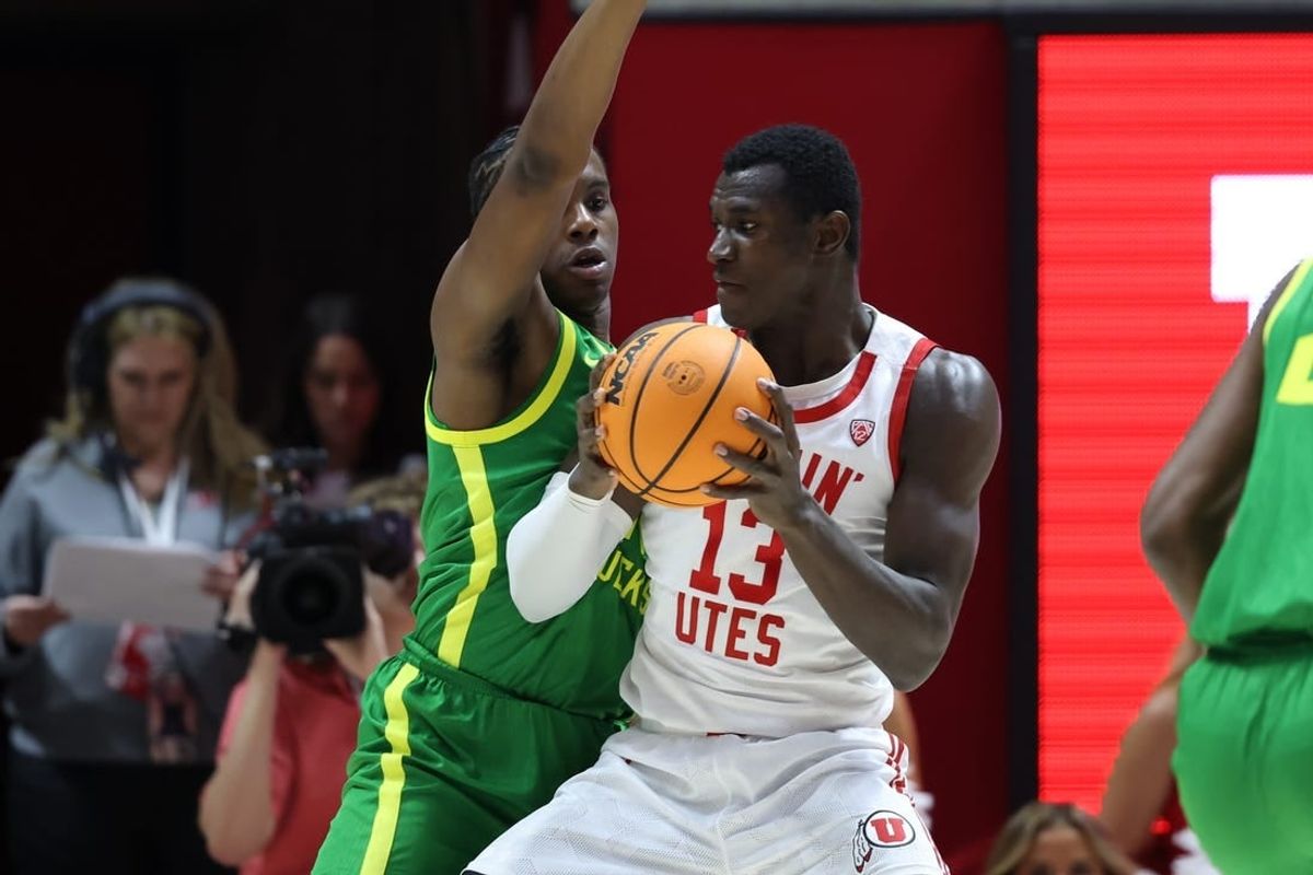Jan 21, 2024; Salt Lake City, Utah, USA; Utah Utes center Keba Keita (13) posts up against Oregon Ducks forward Mookie Cook (11) during the first half at Jon M. Huntsman Center.