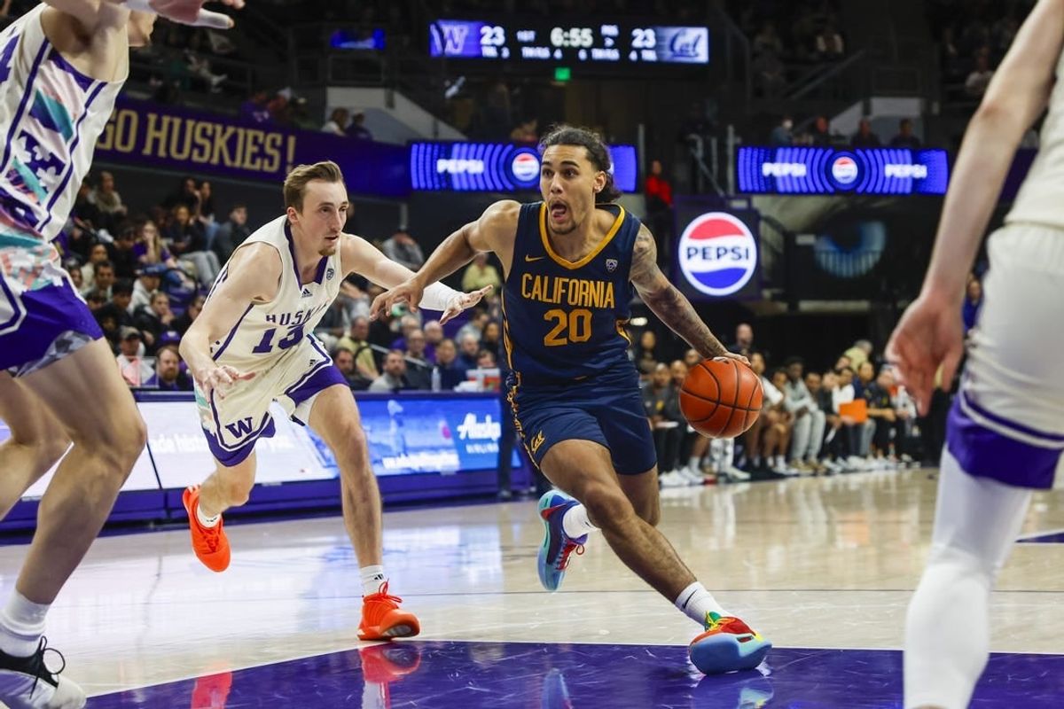 Feb 17, 2024; Seattle, Washington, USA; California Golden Bears guard Jaylon Tyson (20) dribbles past Washington Huskies forward Moses Wood (13) during the first half at Alaska Airlines Arena at Hec Edmundson Pavilion.
