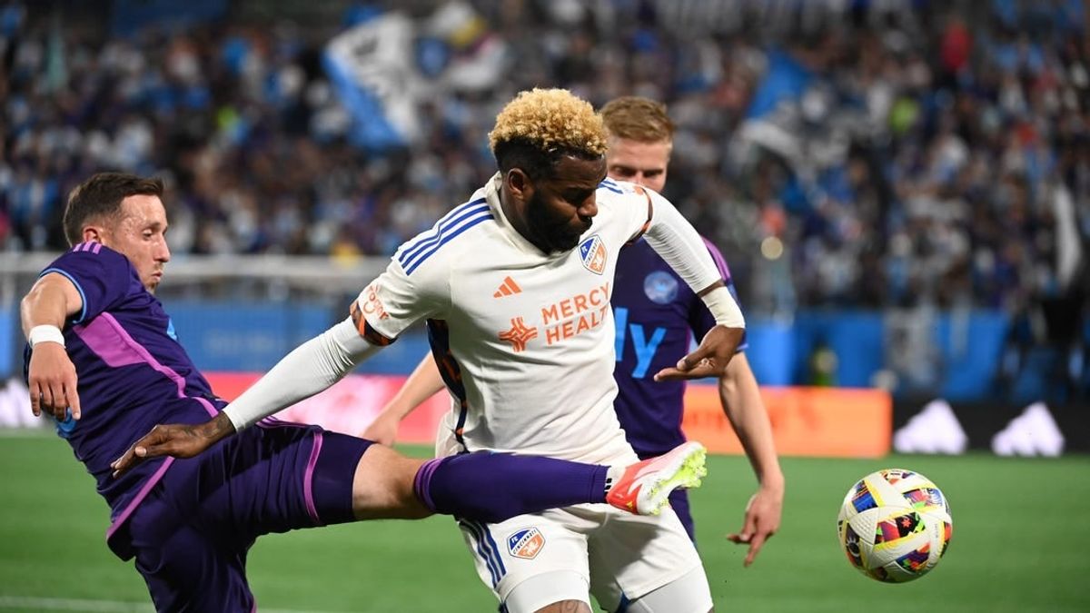 Mar 30, 2024; Charlotte, North Carolina, USA; Charlotte FC midfielder Brecht Dejaegere (10) and FC Cincinnati forward Aaron Boupendza (9) fight for the ball in the first half at Bank of America Stadium.