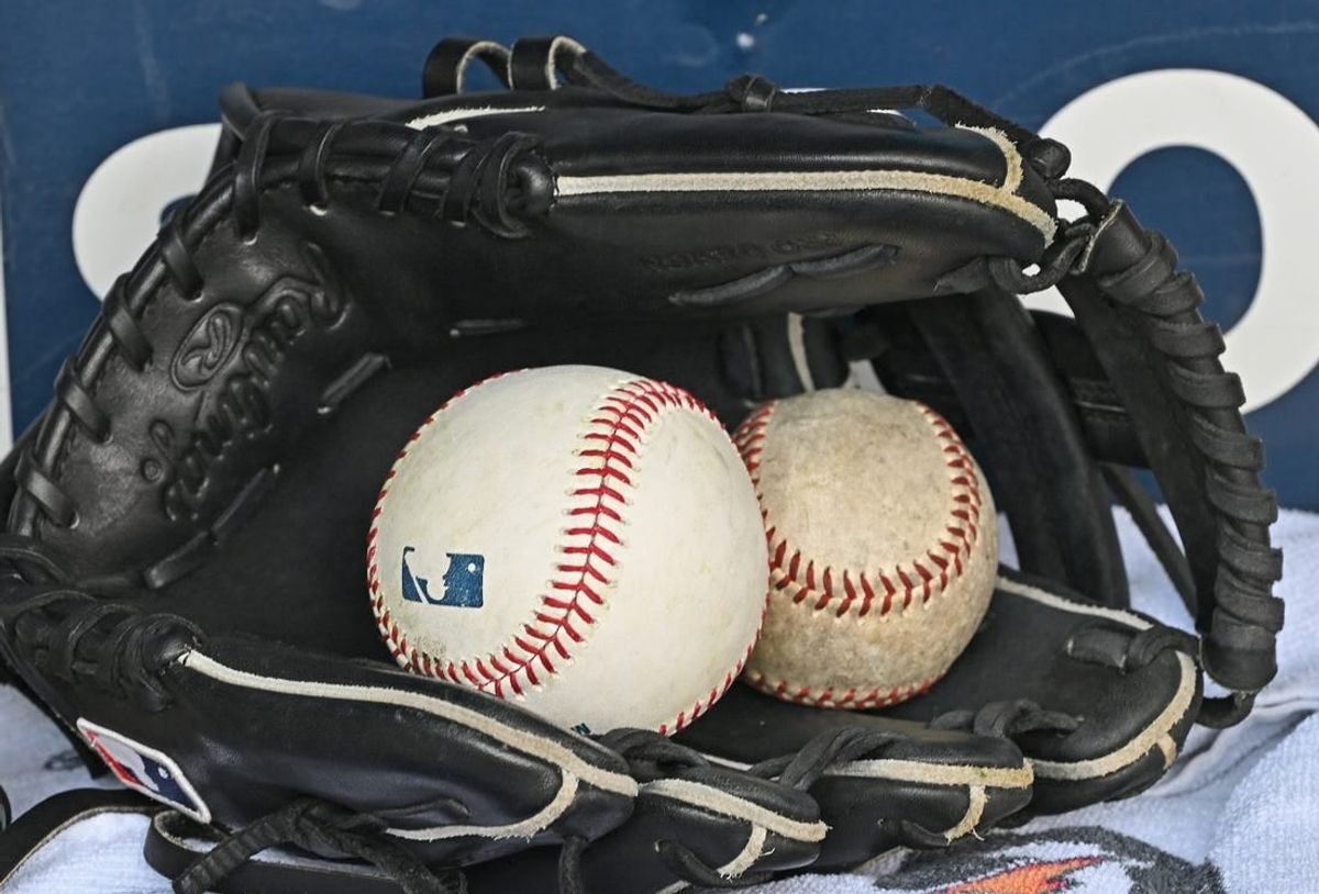 Aug 14, 2022; Kansas City, Missouri, USA;  A general view of a baseball glove and baseballs prior to a game between the Kansas City Royals and Los Angeles Dodgers at Kauffman Stadium.
