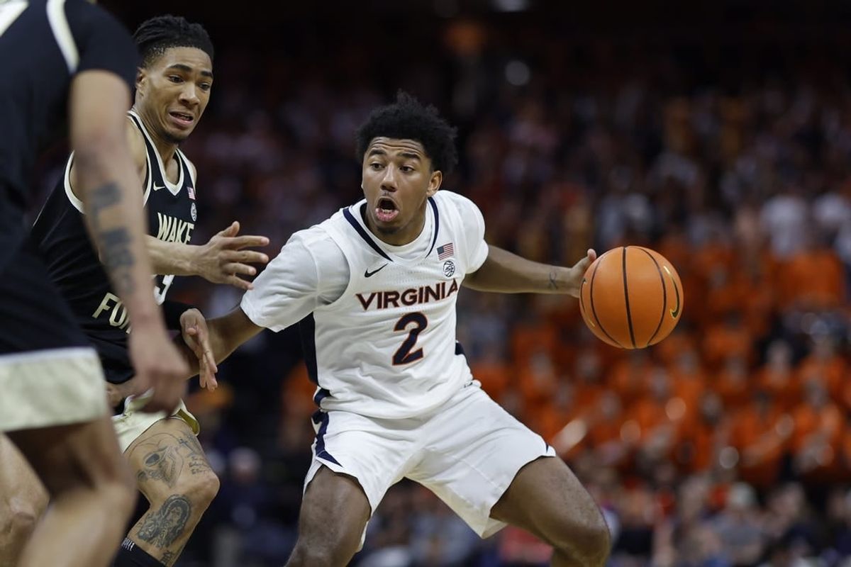 Feb 17, 2024; Charlottesville, Virginia, USA; Virginia Cavaliers guard Reece Beekman (2) drives to the basket as Wake Forest Demon Deacons guard Hunter Sallis (23) defends in the second half at John Paul Jones Arena.
