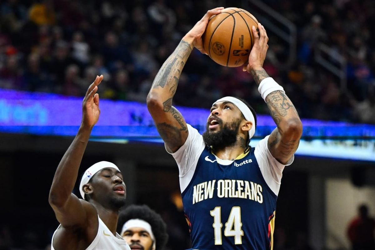 Dec 21, 2023; Cleveland, Ohio, USA; New Orleans Pelicans forward Brandon Ingram (14) drives against Cleveland Cavaliers guard Caris LeVert (3) in the second quarter at Rocket Mortgage FieldHouse.
