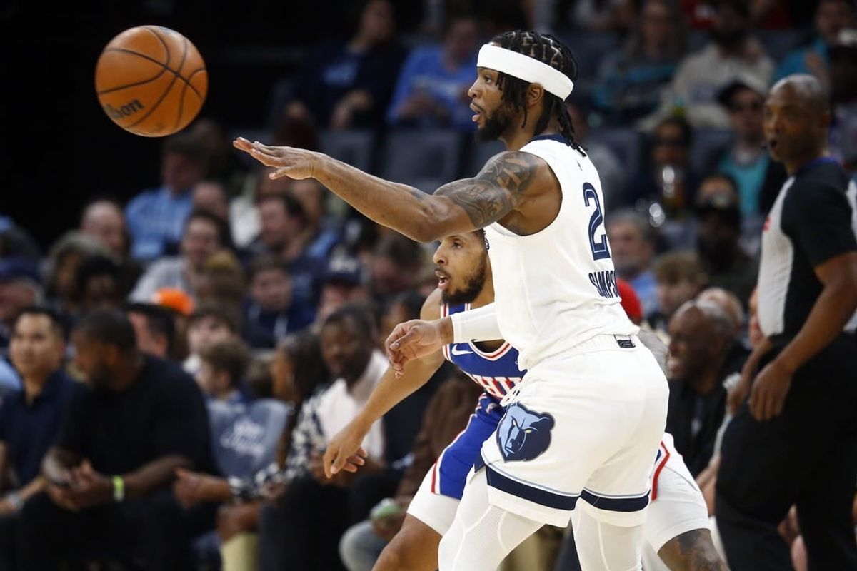 Apr 6, 2024; Memphis, Tennessee, USA; Memphis Grizzlies guard Zavier Simpson (2) passes the ball as Philadelphia 76ers guard Cameron Payne (22) defends during the first half at FedExForum.