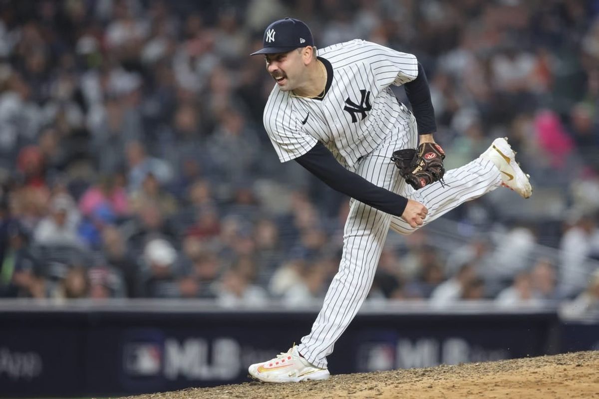 Oct 22, 2022; Bronx, New York, USA;  New York Yankees relief pitcher Lou Trivino (56) pitches in the seventh inning against the Houston Astros during game three of the ALCS for the 2022 MLB Playoffs at Yankee Stadium.