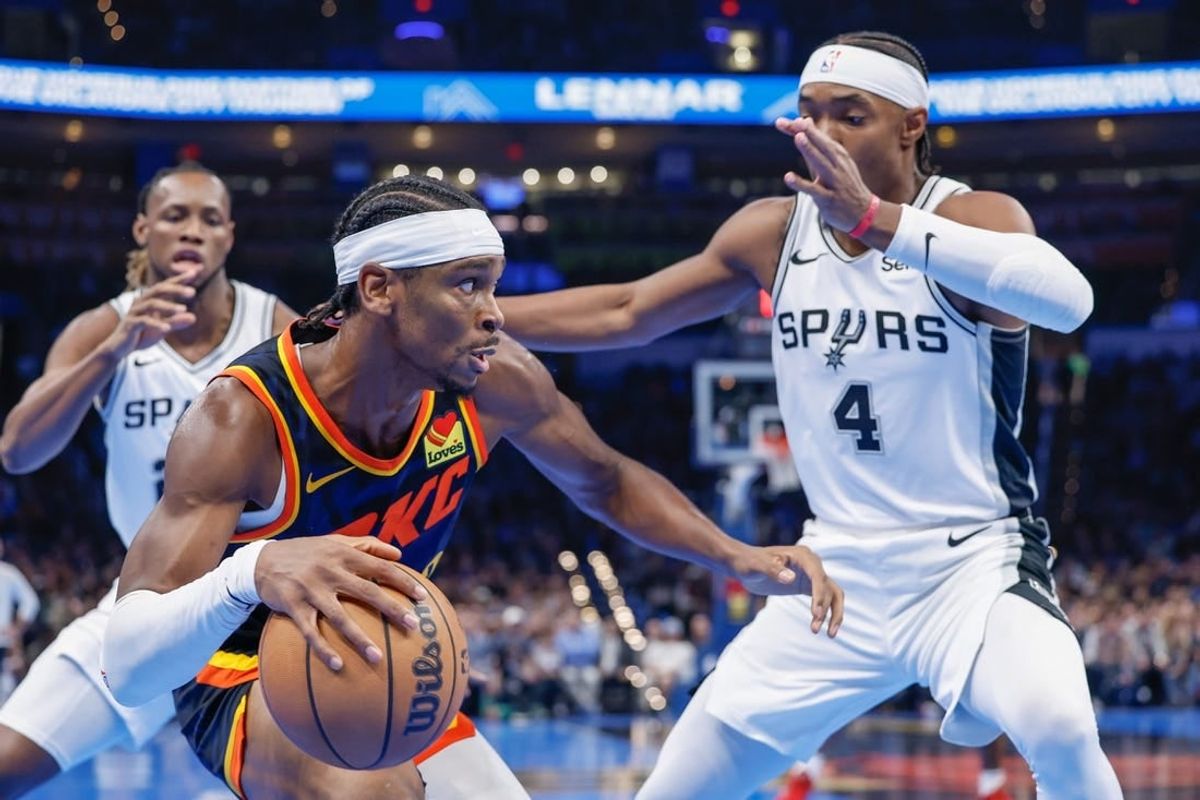 Nov 14, 2023; Oklahoma City, Oklahoma, USA; Oklahoma City Thunder guard Shai Gilgeous-Alexander (2) drives against San Antonio Spurs guard Devonte' Graham (4) during the second half at Paycom Center.