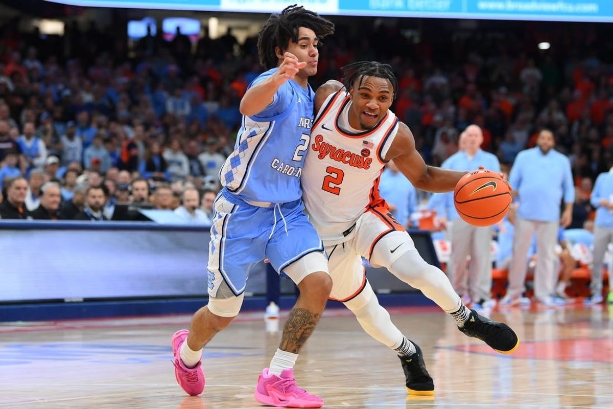 Feb 13, 2024; Syracuse, New York, USA; Syracuse Orange guard JJ Starling (2) drives to the basket as North Carolina Tar Heels guard Elliot Cadeau (2) defends during the second half at the JMA Wireless Dome.