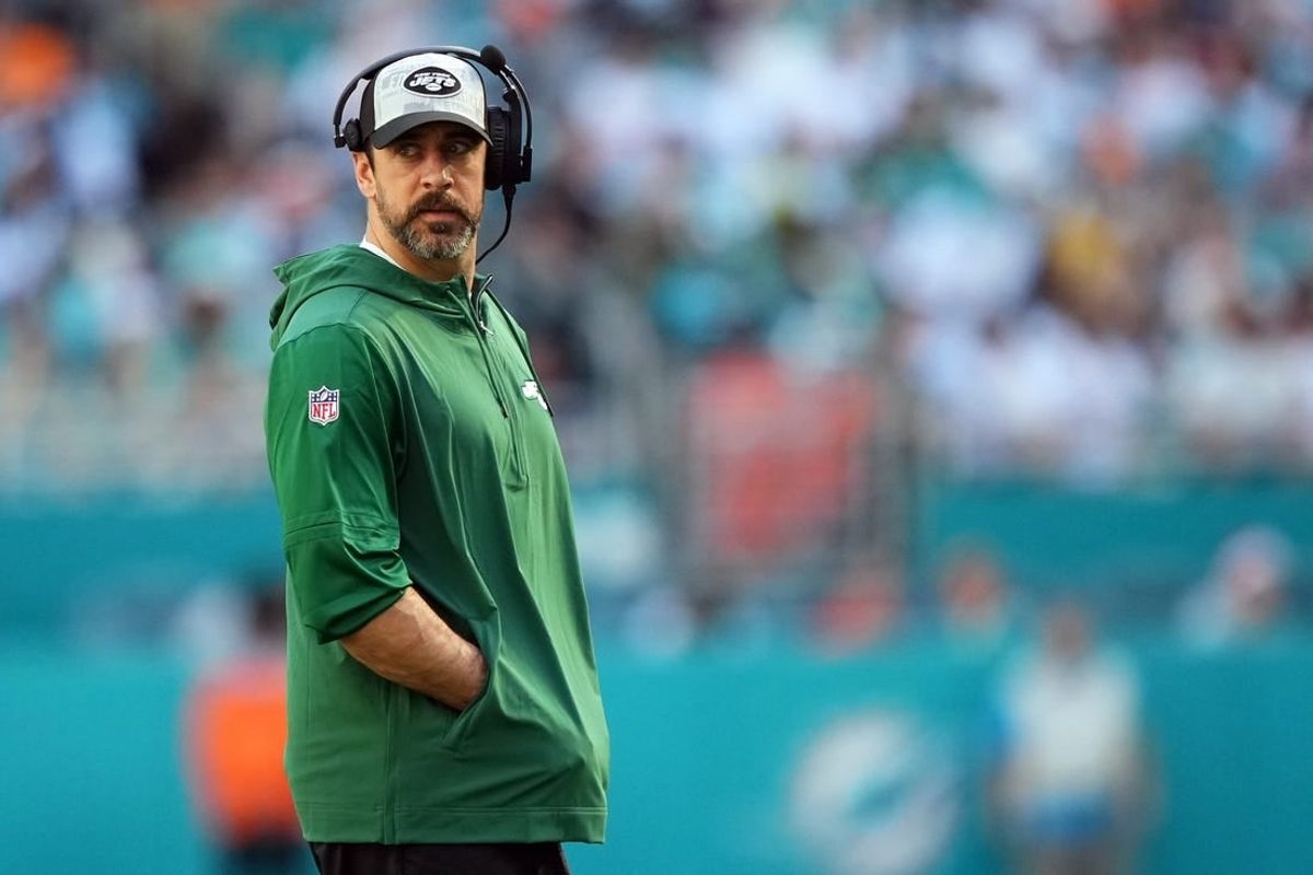 Dec 17, 2023; Miami Gardens, Florida, USA; New York Jets quarterback Aaron Rodgers (8) walks onto the field during an injury timeout in the first half against the Miami Dolphins at Hard Rock Stadium.