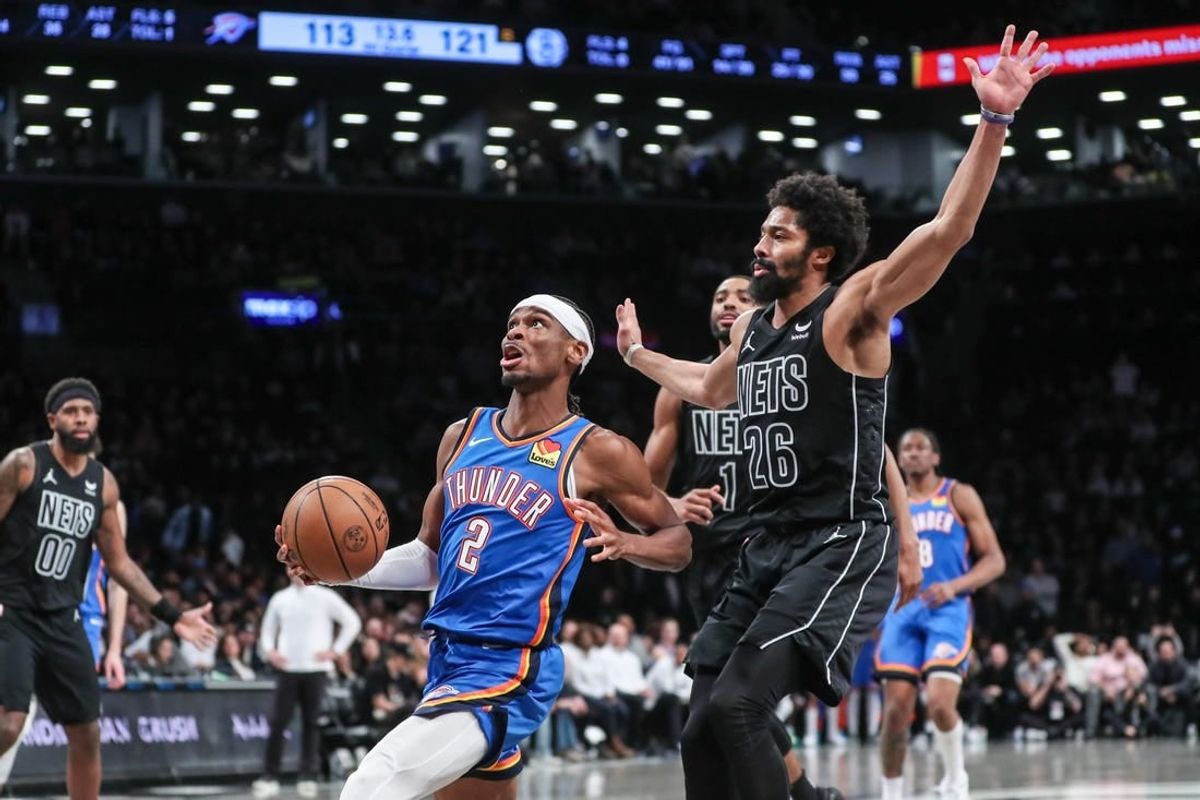 Jan 5, 2024; Brooklyn, New York, USA;  Oklahoma City Thunder guard Shai Gilgeous-Alexander (2) drives past Brooklyn Nets guard Spencer Dinwiddie (26) in the fourth quarter at Barclays Center.