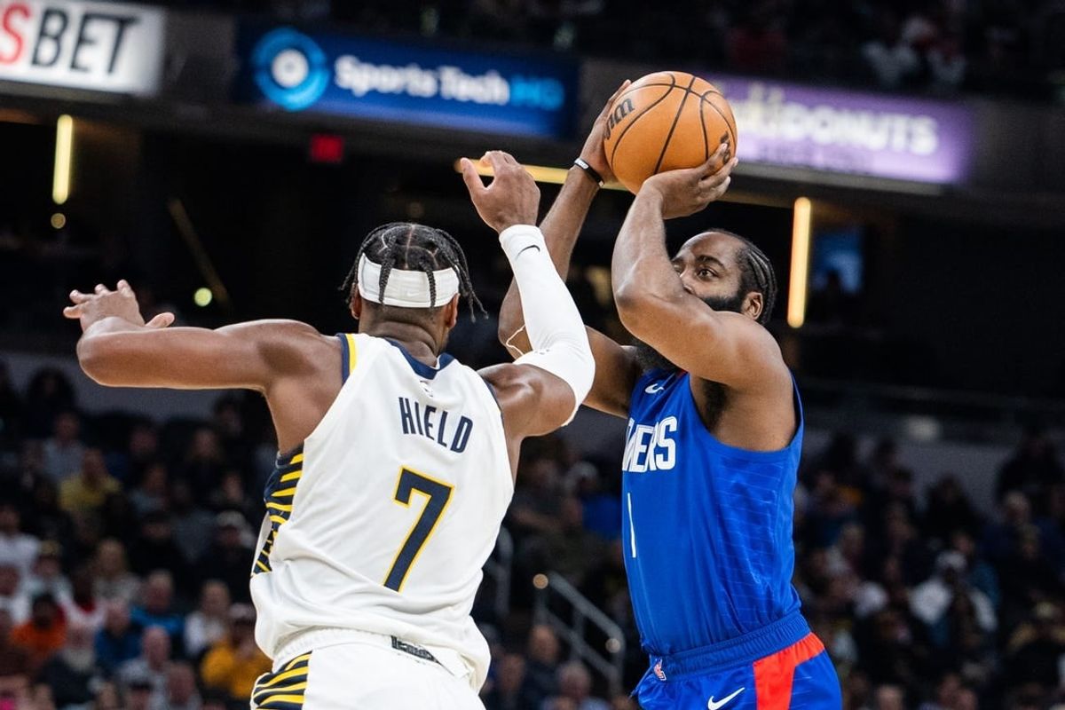Dec 18, 2023; Indianapolis, Indiana, USA; LA Clippers guard James Harden (1) shoots the ball while Indiana Pacers guard Buddy Hield (7) defends in the first half at Gainbridge Fieldhouse.