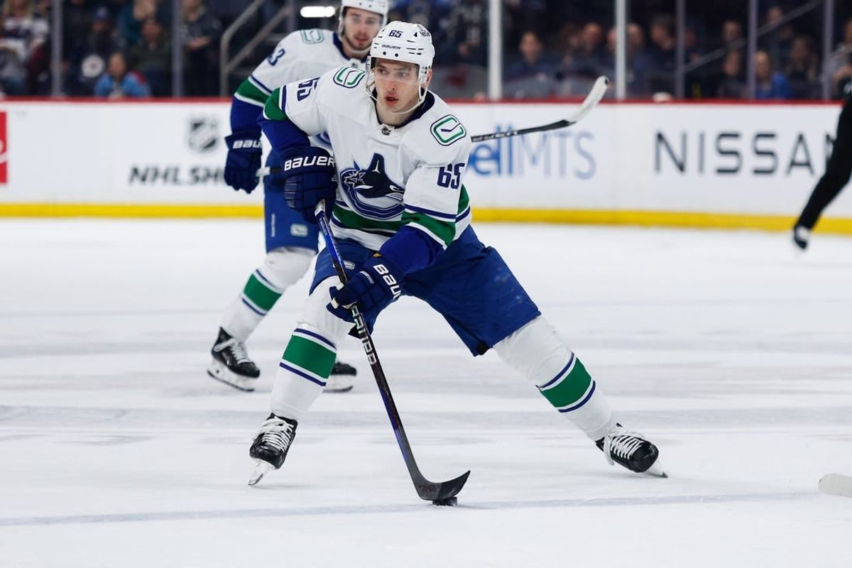 Apr 18, 2024; Winnipeg, Manitoba, CAN;  Vancouver Canucks forward Ilya Mikheyev (65) skates into the Winnipeg Jets zone during the first period at Canada Life Centre.