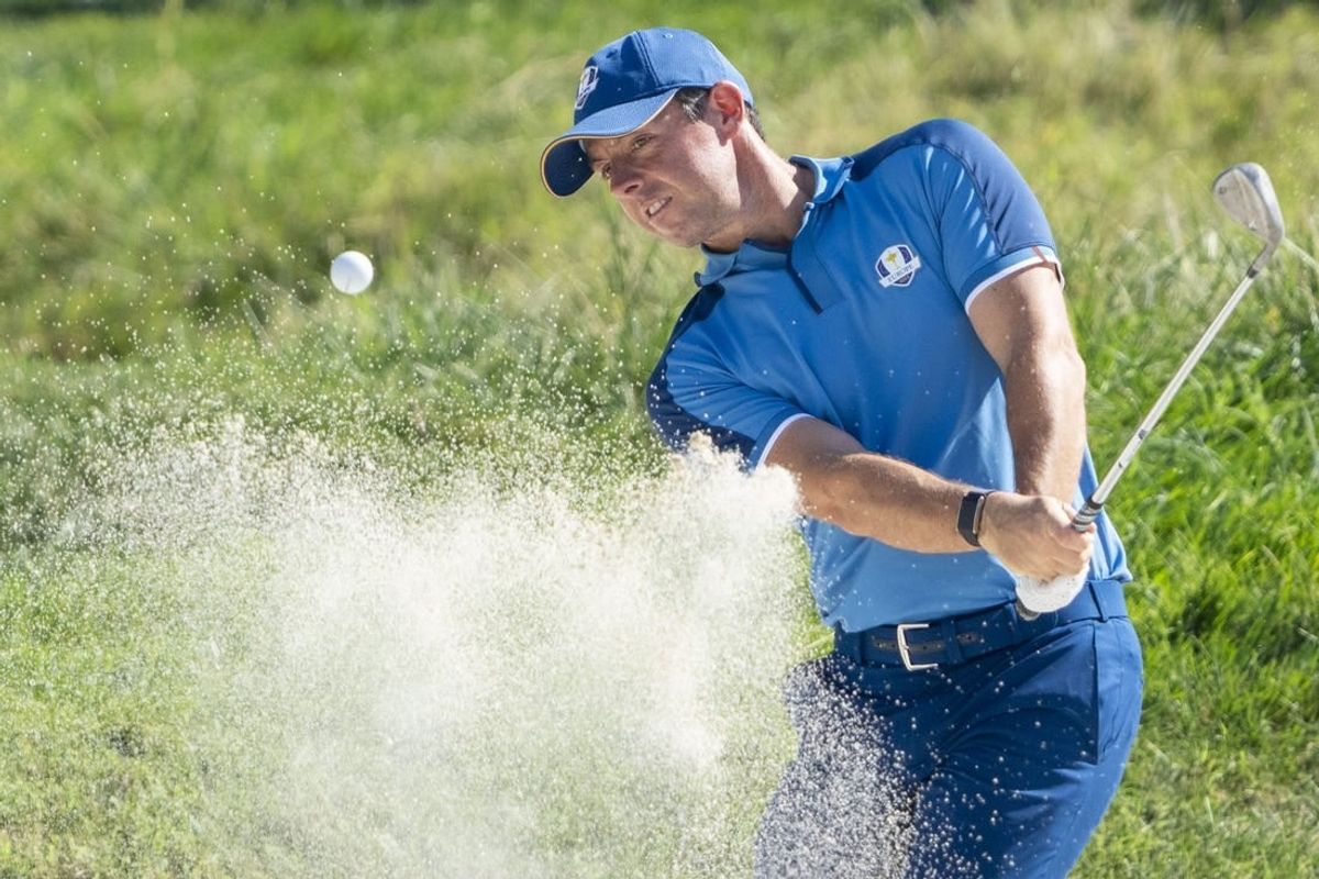 September 27, 2023; Rome, ITA; Team Europe golfer Rory McIlroy hits his bunker shot on the 16th hole during a practice day for the Ryder Cup golf competition at Marco Simone Golf and Country Club.