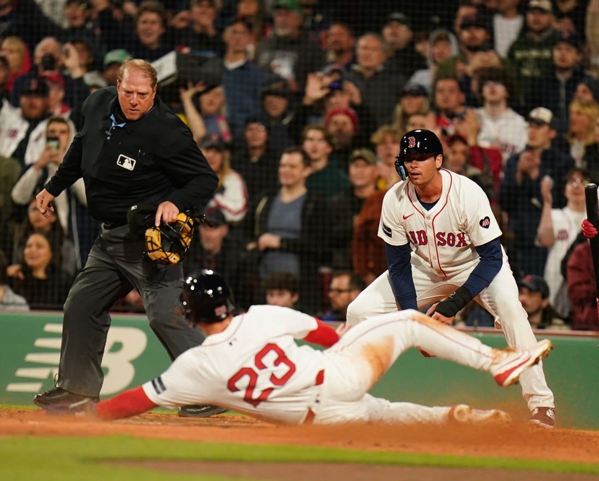 Apr 10, 2024; Boston, Massachusetts, USA; Boston Red Sox shortstop Romy Gonzalez (23) scores against the Baltimore Orioles in the fourth inning at Fenway Park.