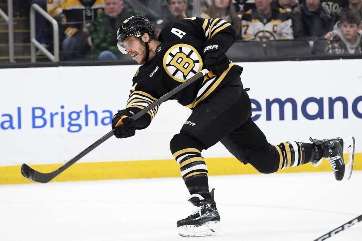 Nov 30, 2023; Boston, Massachusetts, USA; Boston Bruins right wing David Pastrnak (88) shoots the puck during the third period against the San Jose Sharks at TD Garden.