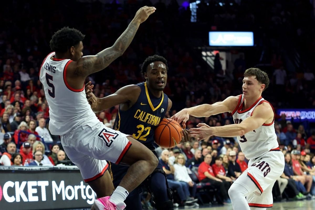 Feb 1, 2024; Tucson, Arizona, USA; California Golden Bears guard Jalen Celestine (32) drives to the net against Arizona Wildcats guard KJ Lewis (5) and guard Pelle Larsson (3) during the first half at McKale Center.