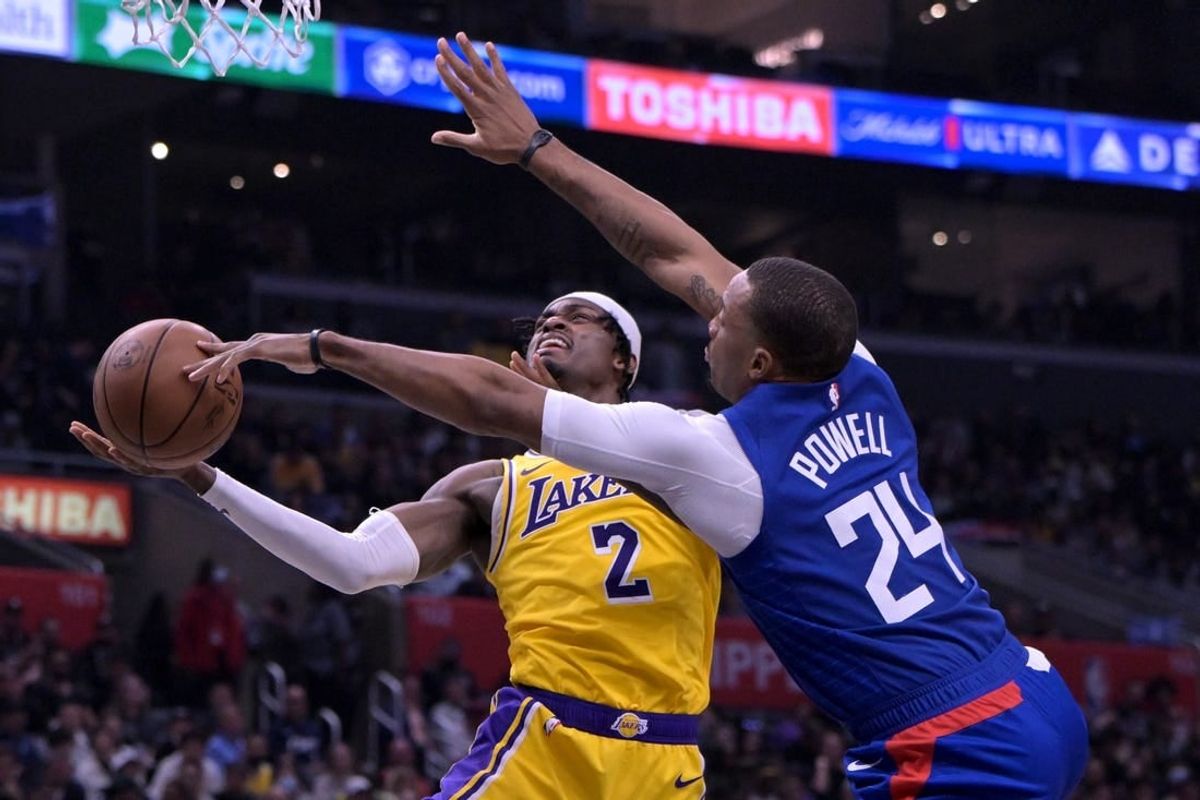 Jan 23, 2024; Los Angeles, California, USA; Los Angeles Clippers guard Norman Powell (24) blocks a shot by Los Angeles Lakers forward Jarred Vanderbilt (2) in the second half at Crypto.com Arena.